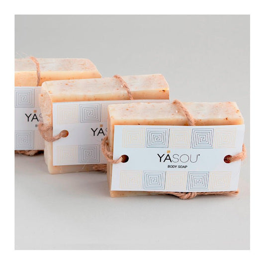 Body Soap: Three bars of YASOU body soap with Rosebud and peppercorns on a light gray background.