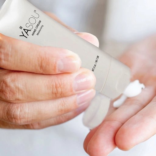 Man putting on YASOU vegan hand cream.