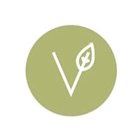 Green circle with a white leaf symbol on a white background