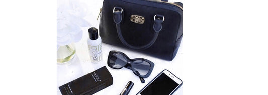 Travel bag with various travel musts for YASOU's blog post called "Prepping Your Skin for Overseas Travel The Minimalist Way"
