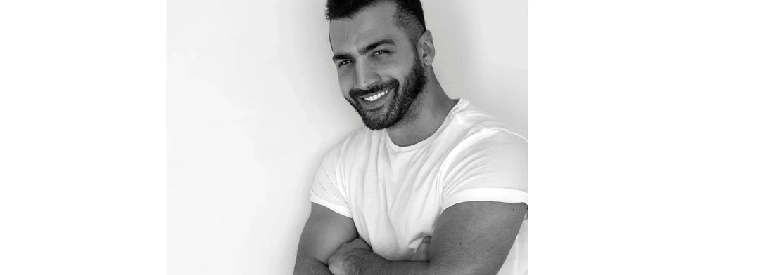 Handsome man with arms crossed for yasou blog post called "Spring 2026: The New Frontiers in Men’s Skincare & Longevity"