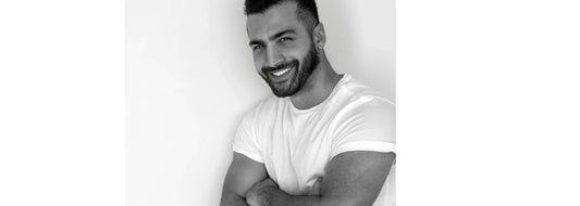 Handsome man with arms crossed for yasou blog post called "Spring 2026: The New Frontiers in Men’s Skincare & Longevity"