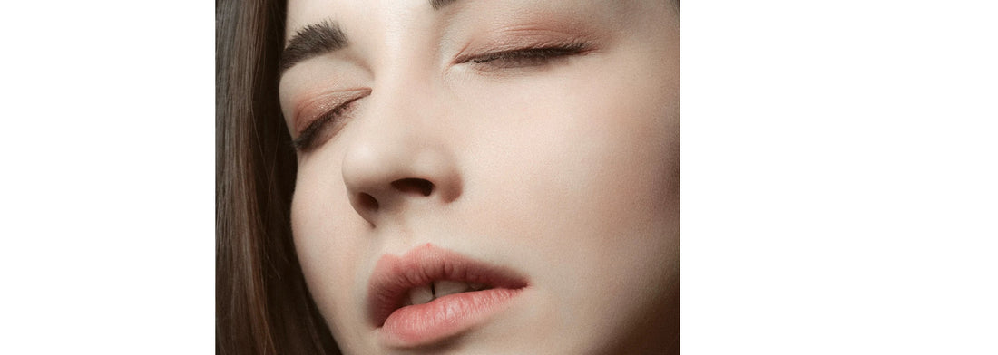 Woman's face thinking for YASOU's blog post called "Your Skin Hears How You Feel: Learn to Listen to Its Needs."