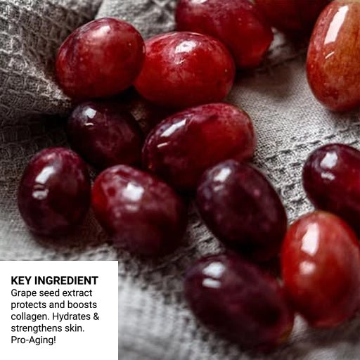 Close-up of red grapes on a textured fabric background with text about grape seed extract benefits.