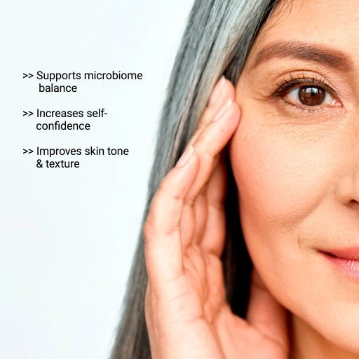 Woman with gray hair touching her face, with text about skin benefits on a light gray background